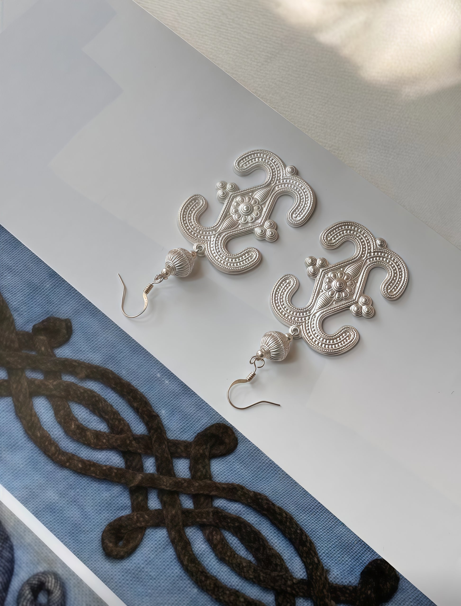 Silver earrings with traditional patterns