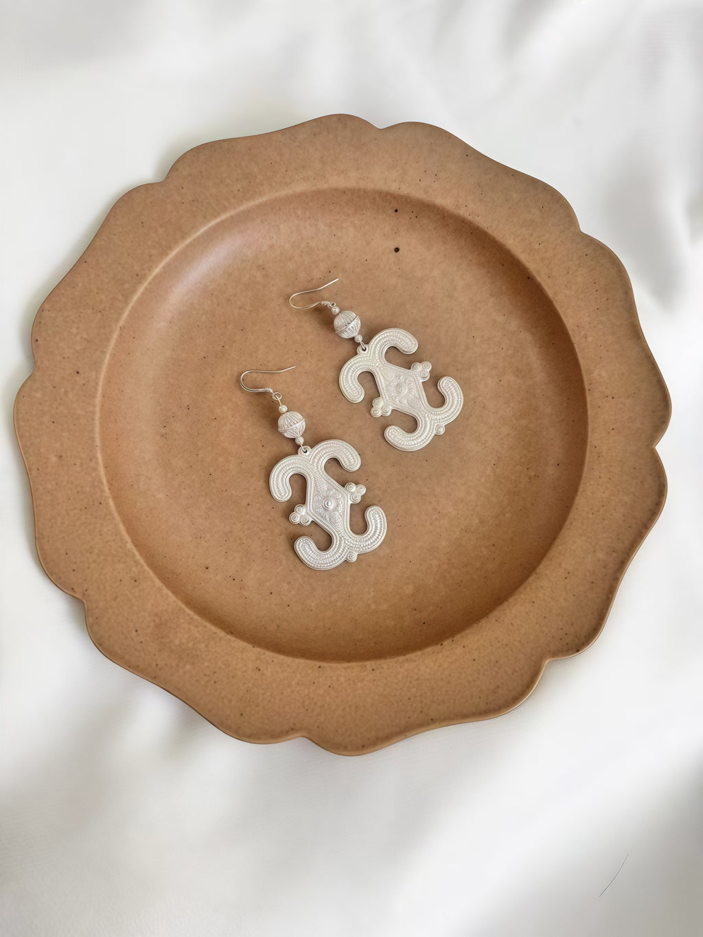 Silver earrings with traditional patterns